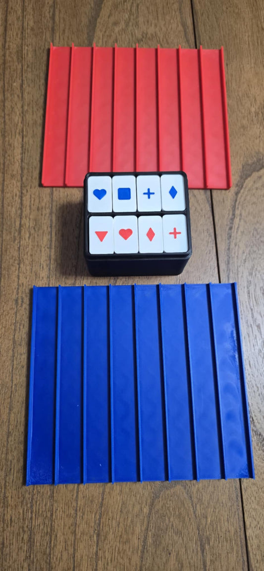 Red and blue push tile game set with two grids.