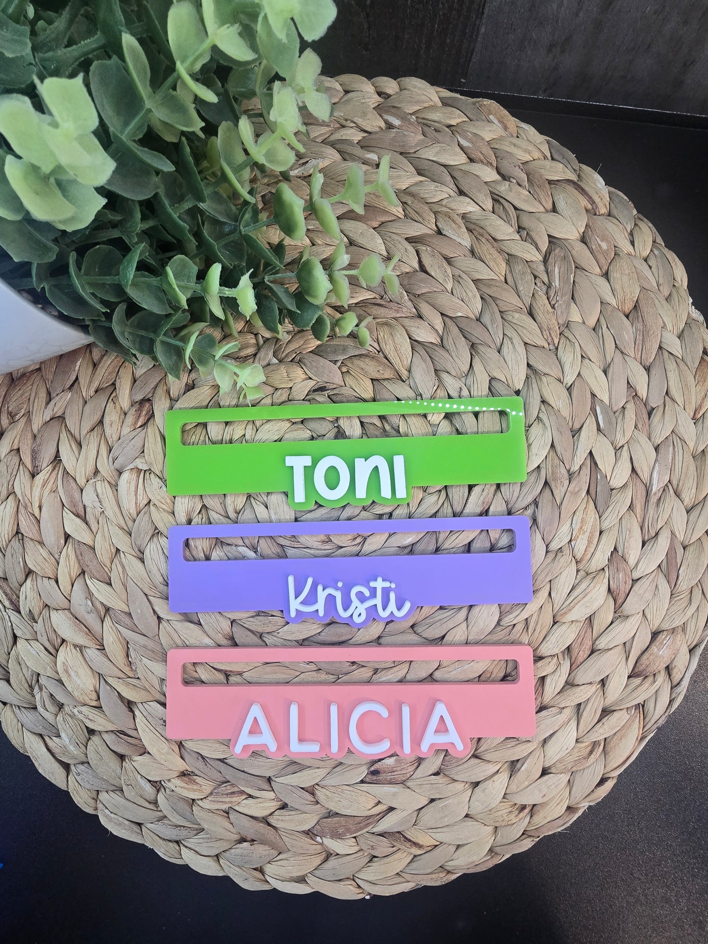 Three personalized Mahjong line readers in green, purple, and pink acrylic, custom engraved with the names Toni, Kristi, and Alicia